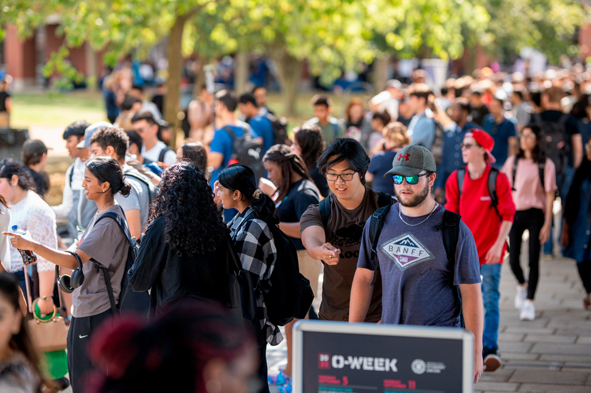 Students lined up for BBQ during Orientation Week events.