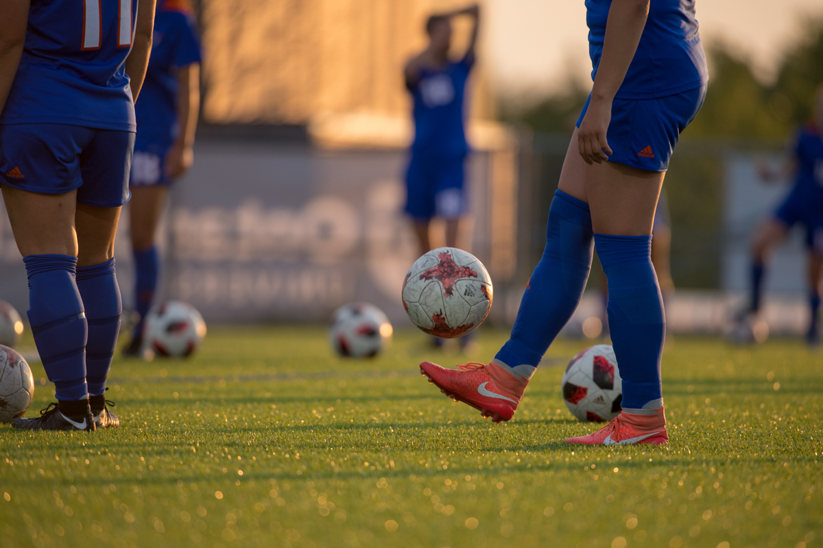 women's soccer team warming up. 