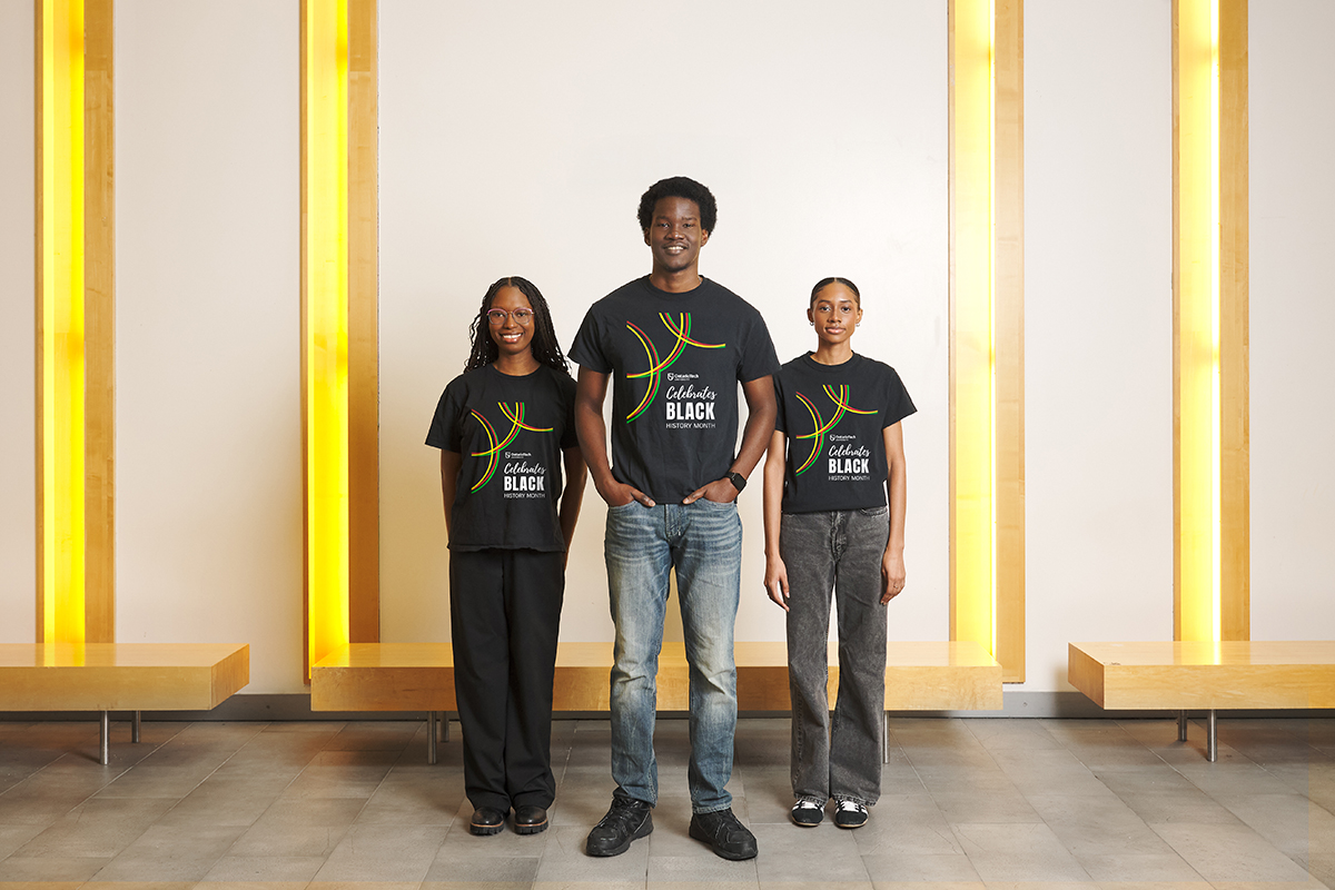Photo of three students wearing the Black History Month T-shirt