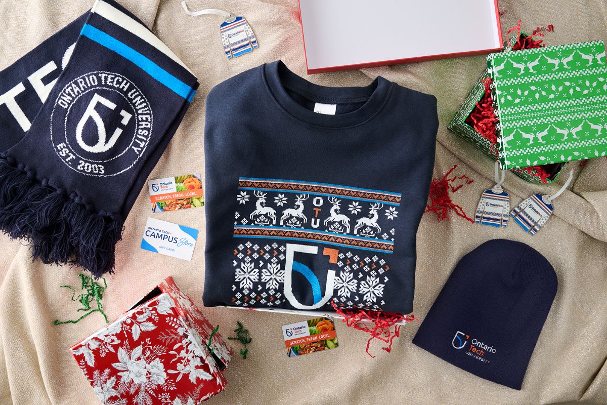 Photo of the holiday sweater, matching ornament, toque, scarf and gift cards